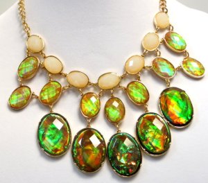 Necklace with stones set in settings with open backs